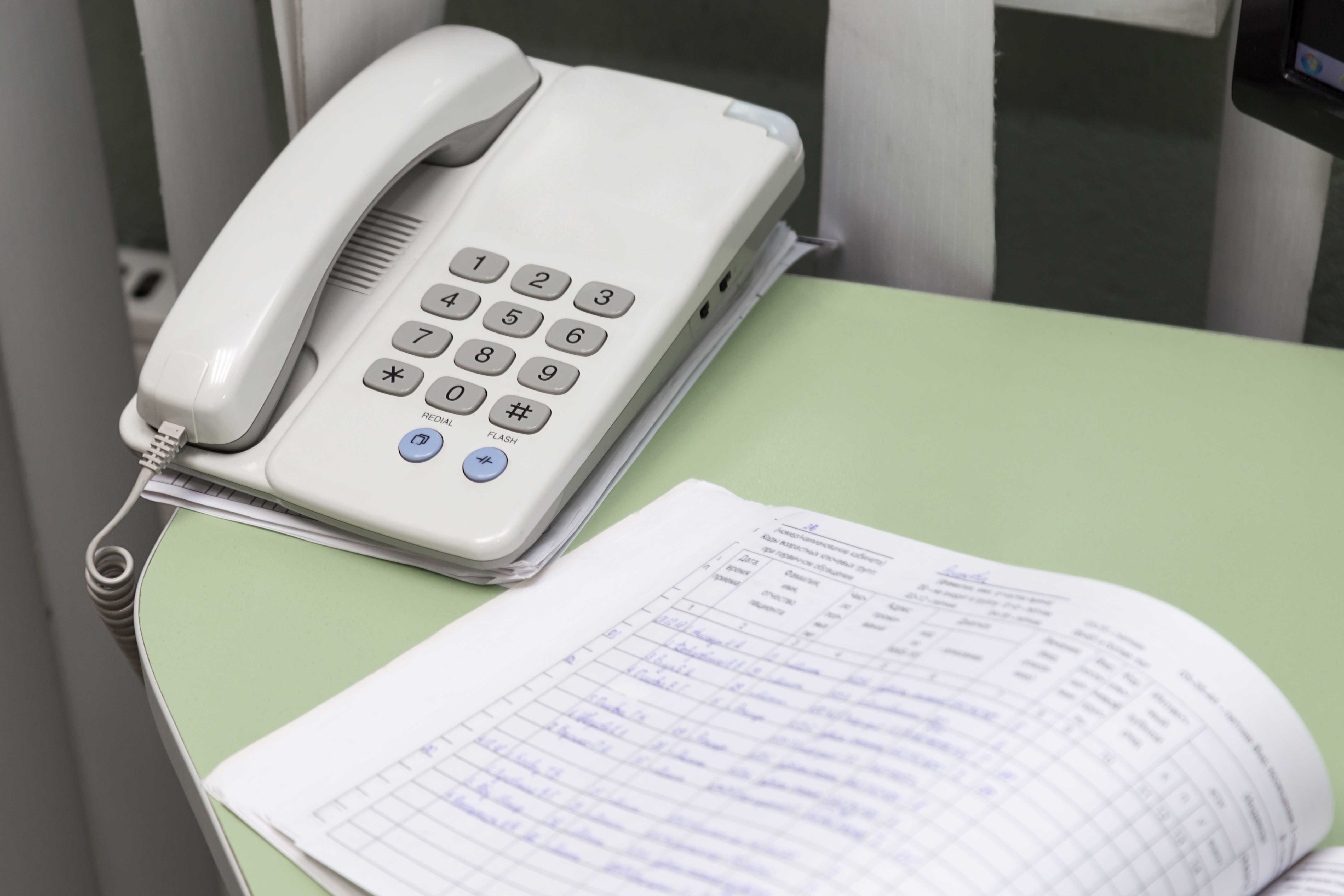 push-button-telephone-and-a-book-for-writing-on-th-2021-08-29-20-56-35-utc